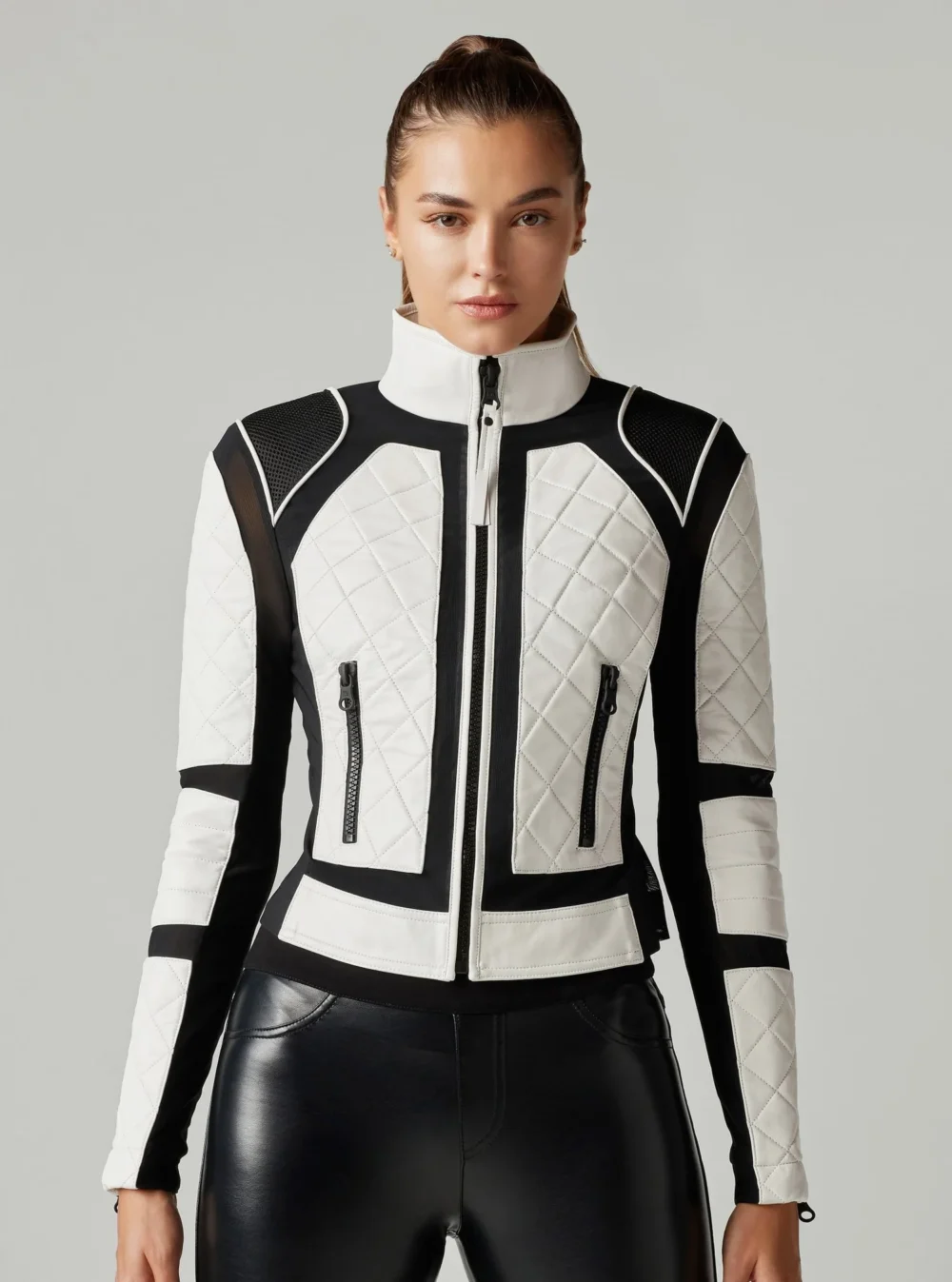 Rider wearing a Black and White Motorcycle Jacket for enhanced visibility and style