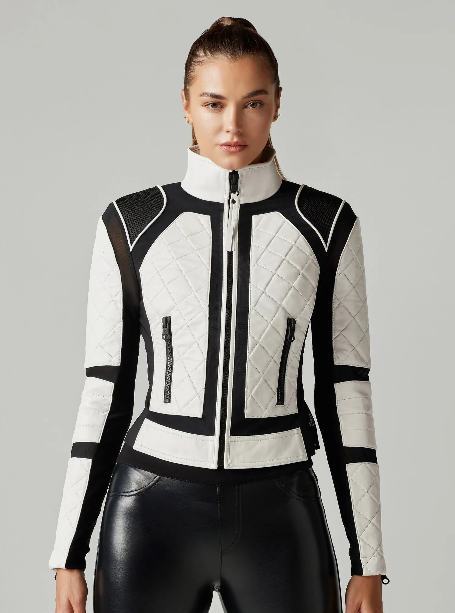Rider wearing a Black and White Motorcycle Jacket for enhanced visibility and style